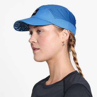 side view of ciele athletics FSTCap SC EQ Frames unisex running hat in palace blue color on a model