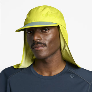 front view of ciele athletics GOCap PYN Comp one hundred unisex running bucket hat in lucifer yellow color on a model