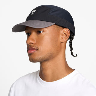 side view of the ciele athletics GOCap with a curved brim unisex running hat in whitaker color, on a model