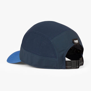 back view of ciele athletics GOCap Comp C cube unisex running hat in indigo color