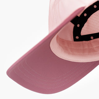 underbrim view of the ciele athletics GOCap with a curved brim unisex running hat in peachskin color