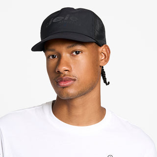 front view of the ciele athletics TRLCap unisex running hat with a curved brim in shadowcast color, on a model