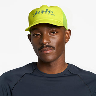 front view of ciele athletics TRLCap SC Comp one hundred unisex running hat in lucifer yellow color on a model