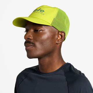 side view of ciele athletics TRLCap SC Comp unisex running hat in lucifer yellow color on a model