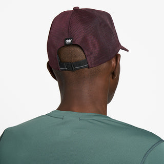 back view of ciele athletics TRLCap SC Comp unisex running hat in dark wine red color on a model