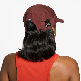 back view of ciele athletics GOCap SC Comp Word Wild Mouvement unisex running hat for the London marathon on a model