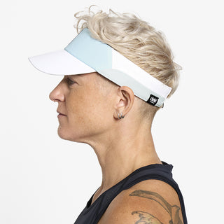 side view of ciele athletics FSTCap Comp Iconic VC unisex running hat in skyblue color on a model