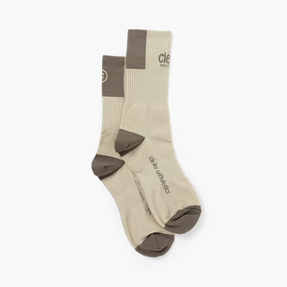 beige socks with brown accents on a white background