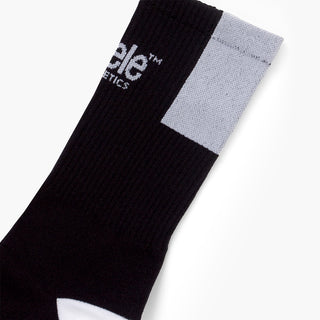 elastic of black sock with white patch on a white background