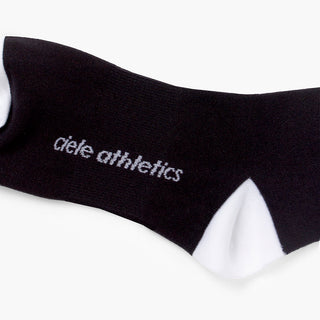 black sock with white accents and 'ciele athletics' branding on a white background