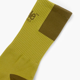 elastic of green sock with dark green patch on a white background