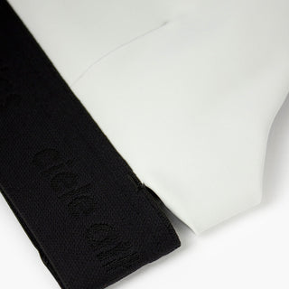 close view of the elastic and fabric of the ciele athletics QCKBra running bra in light grey