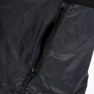 closeup view of the zippered side pocket of the ciele athletics VNTJacket lightweight running jacket for women in shadowcast color