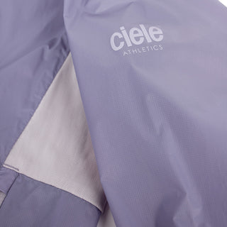 closeup view of the reflective sleeve logo of the ciele athletics VNTJacket lightweight running jacket for women in grape color