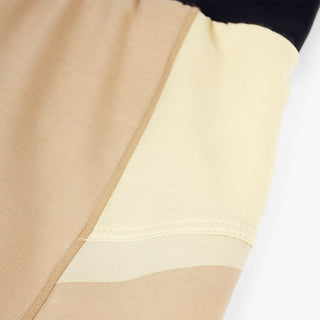 close view of the fabric and construction on the ciele athletics TRNShort 4 inch with a brief in safari color