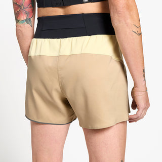 close back view of ciele athletics TRNShort 4 inch with a brief in safari color on a model