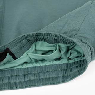 close view of the hidden front pocket of the ciele athletics ATShort 4 inch with liner short in silver pine color