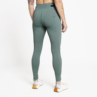 back view of ciele athletics FSTTight running tight in silver pine on a model