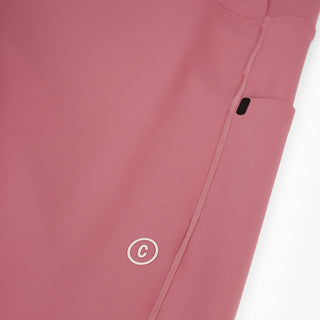 close view of the reflective C logo on the ciele athletics FSTTight running tight in deco rose